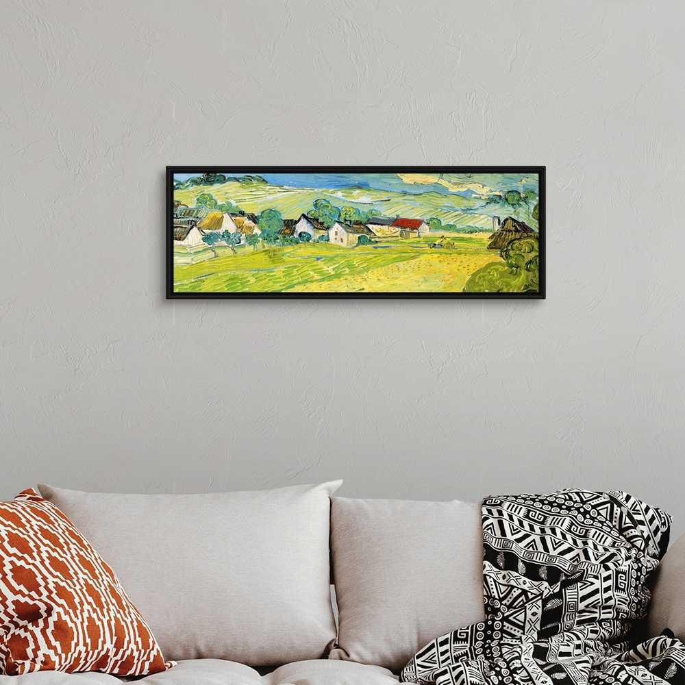 A bohemian room featuring Painting of a beautiful landscape of a village and fields by Vincent Van Gogh.
