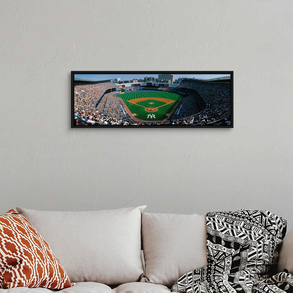 A bohemian room featuring Panoramic photograph taken at Yankee Stadium in the Bronx, New York displays fans enjoying a base...