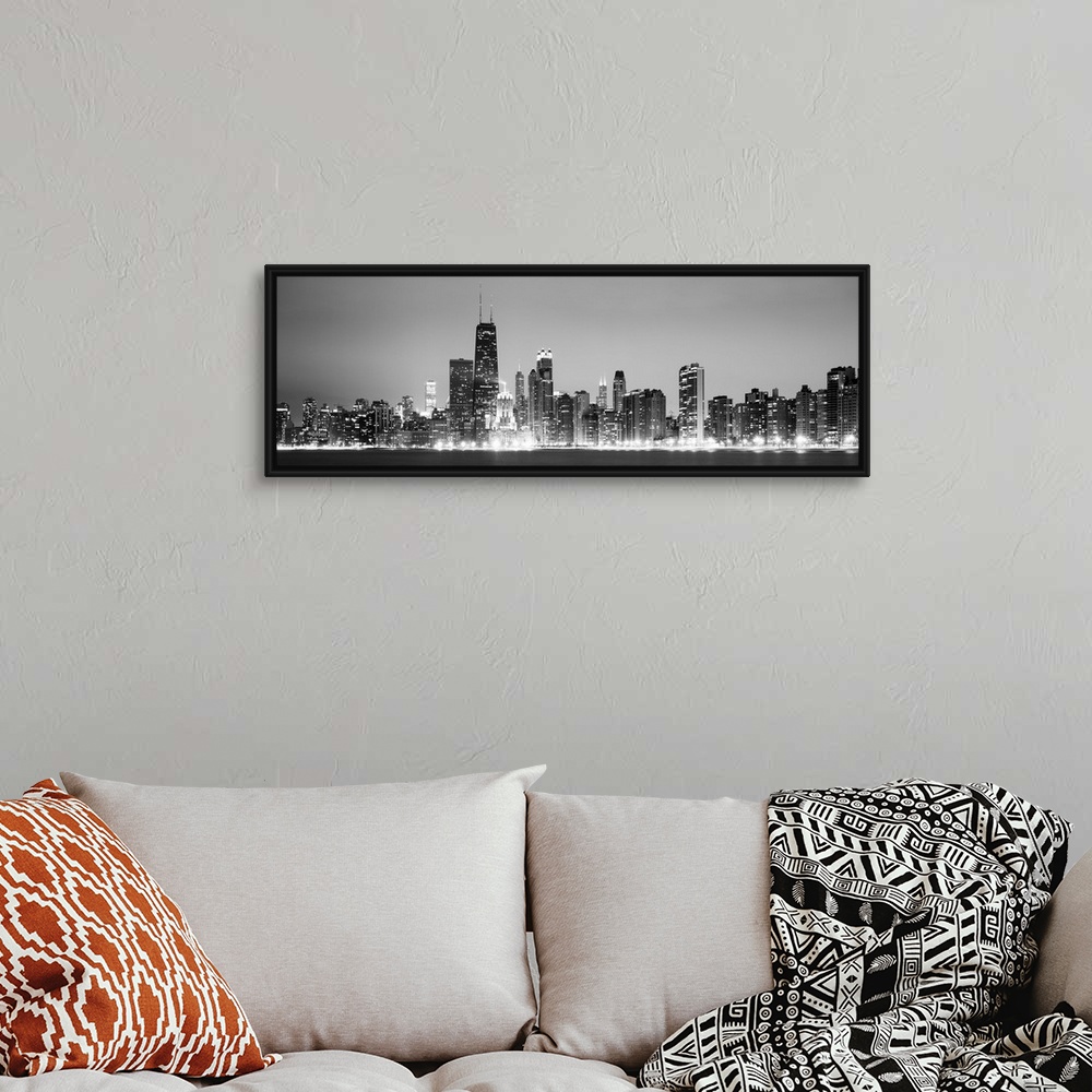 A bohemian room featuring Panoramic view of the Chicago city skyline illuminated in the early evening, seen from across the...