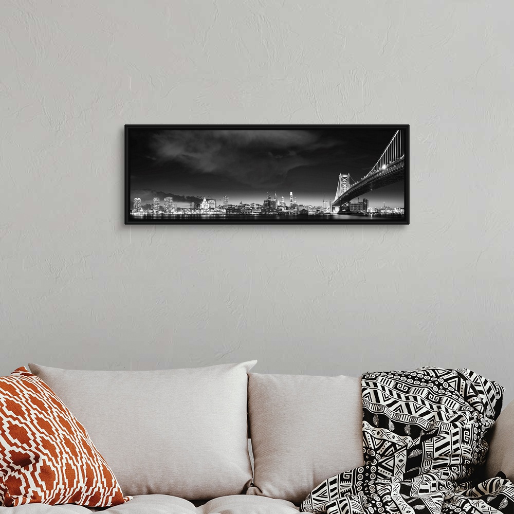 A bohemian room featuring Panoramic photo of the Philadelphia city skyline at night, with the Benjamin Franklin Bridge on t...