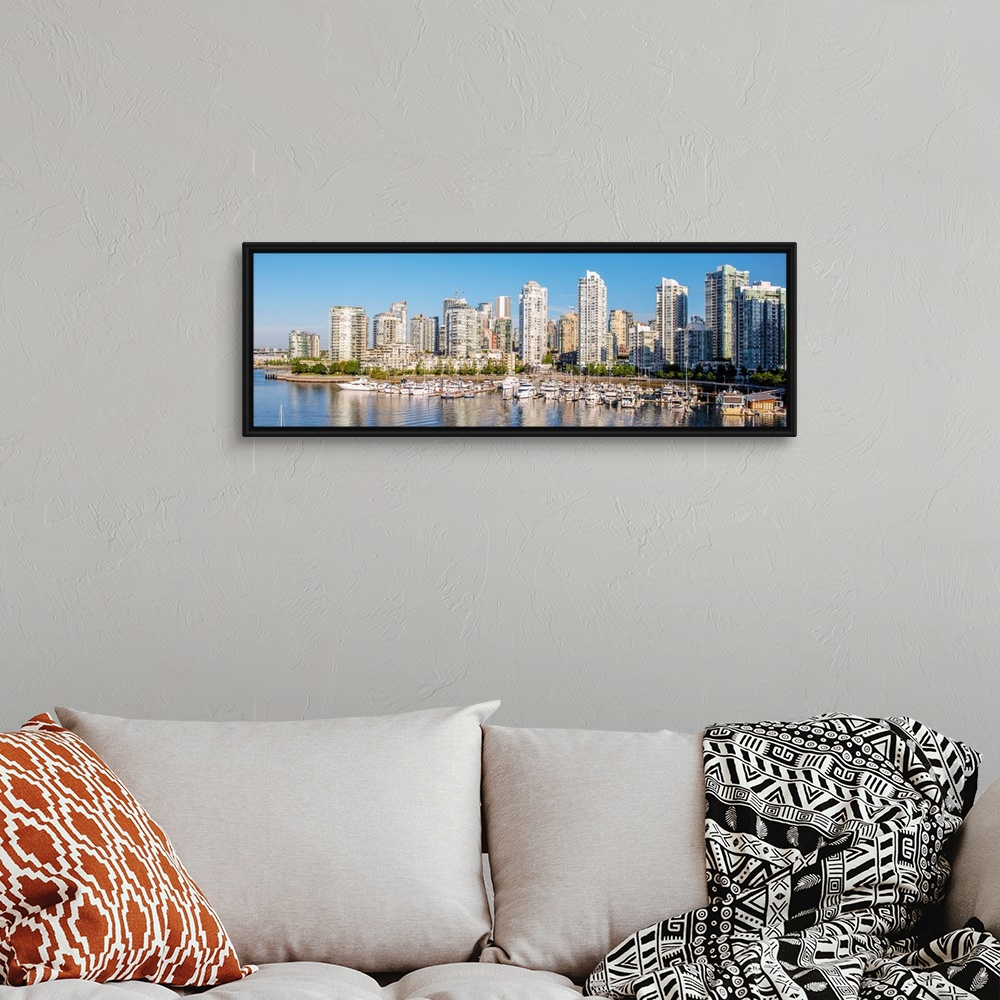 A bohemian room featuring Panoramic photograph of part of the Vancouver, British Columbia skyline with False Creek Harbor a...