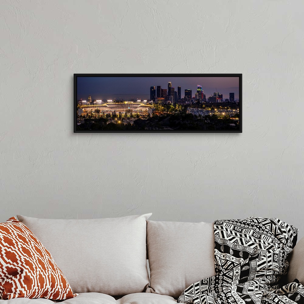 A bohemian room featuring Panoramic photograph of Dodger Stadium lit up on a game night with the Los Angeles skyline on the...