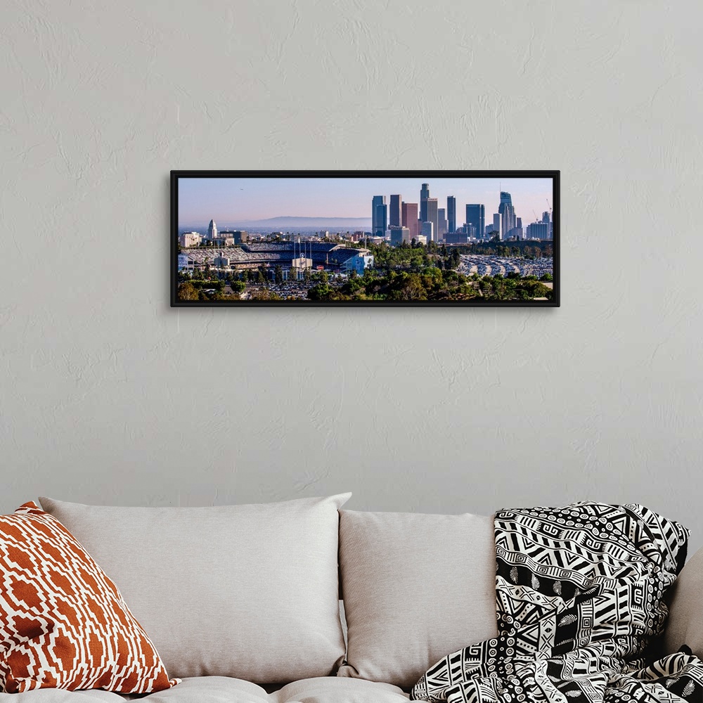 A bohemian room featuring Panoramic photograph of the downtown Los Angeles skyline with Dodger Stadium on the left.