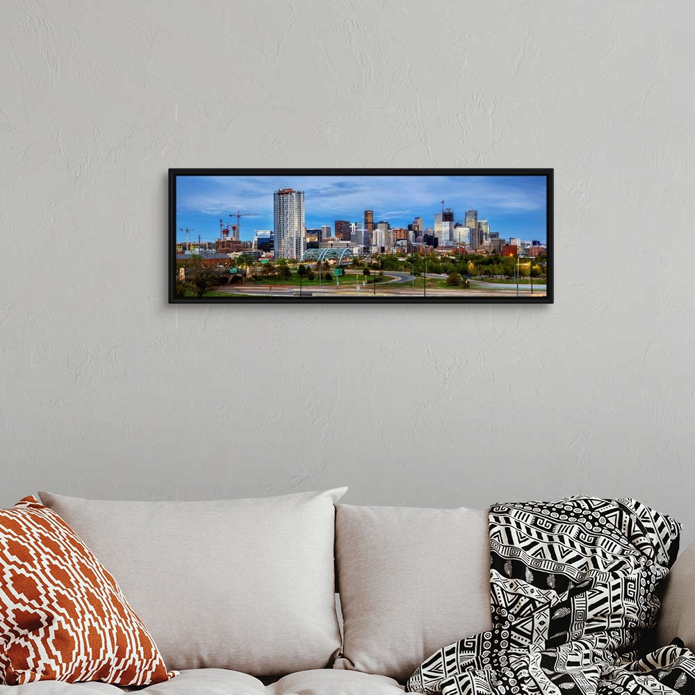A bohemian room featuring Photo of a Denver's skyline with light trails.