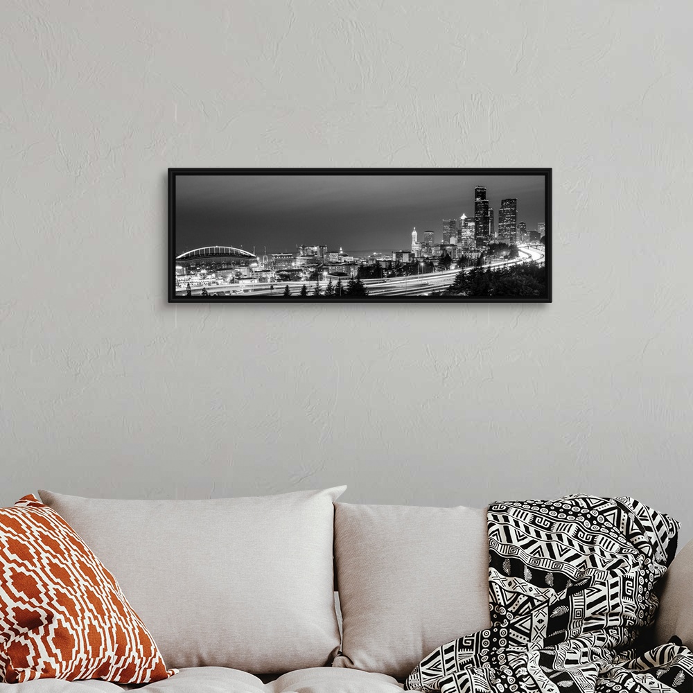 A bohemian room featuring Panoramic photograph of the Seattle skyline with the stadium on the left and light trails from tr...