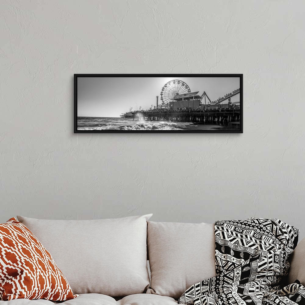 A bohemian room featuring Panoramic photograph of the Santa Monica Pier in Los Angeles, California, with the sun setting ri...
