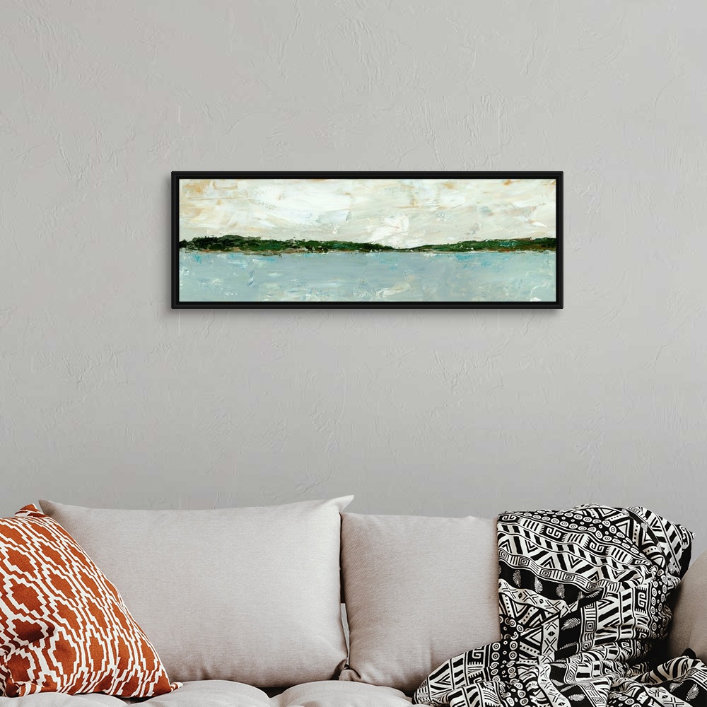 A bohemian room featuring A long, panoramic abstract of a lake or ocean scene, with stormy blue waters under a cloudy sky. ...