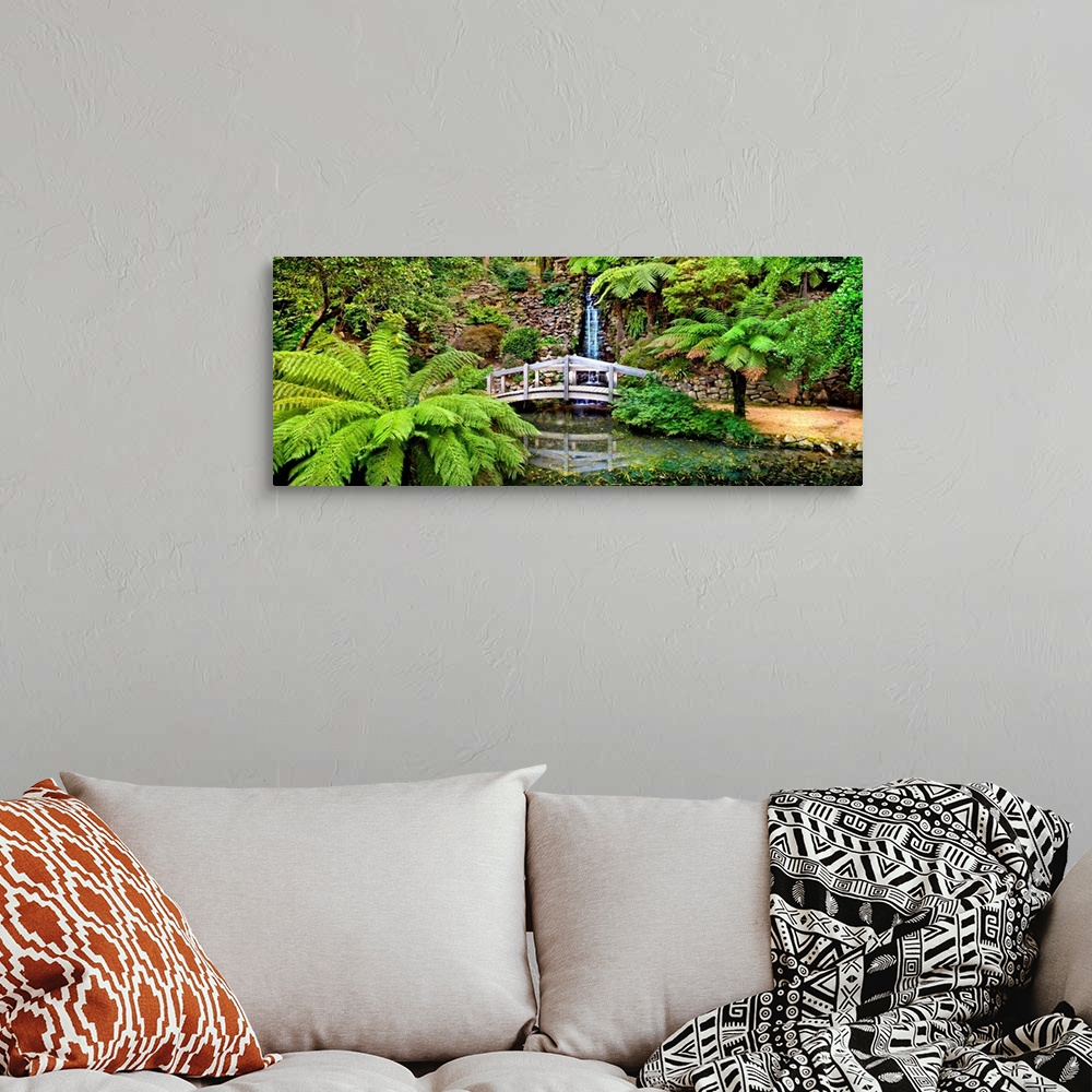 A bohemian room featuring Footbridge and waterfall in a forest, Dandenong Forest, Melbourne, Victoria, Australia.