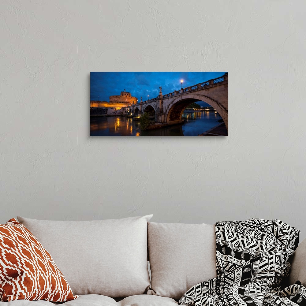 A bohemian room featuring Ponte Sant'Angelo over river with Hadrian's Tomb in the background, Rome, Lazio, Italy.
