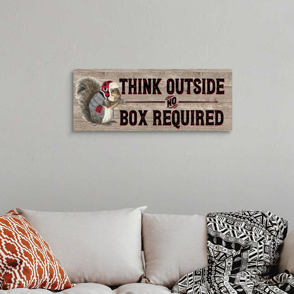 A bohemian room featuring Decorative image of 'Think Outside No Box Required' with a squirrel wearing a plaid cap and vest ...