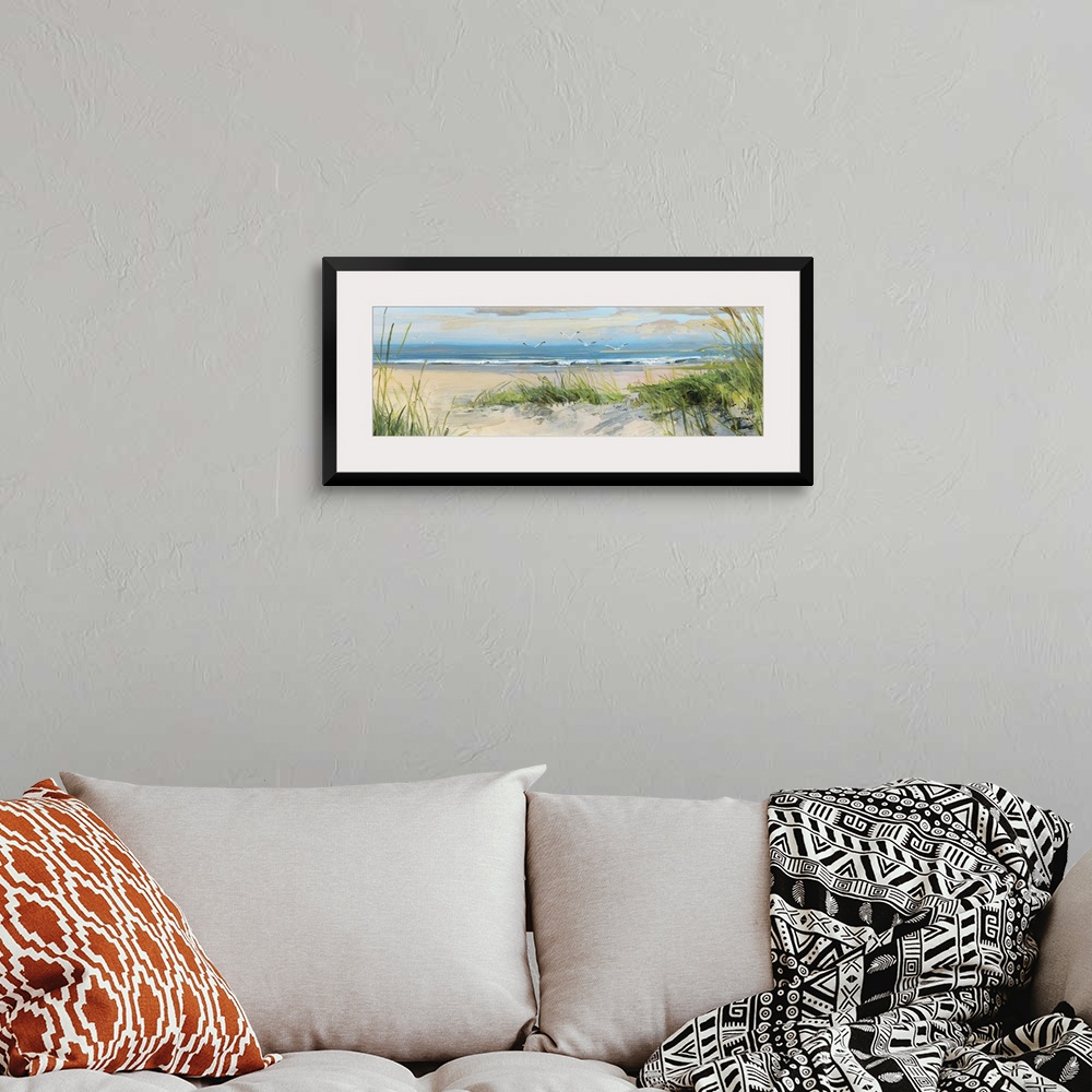 A bohemian room featuring Contemporary landscape painting of grass on a sandy beach at the edge of the ocean.