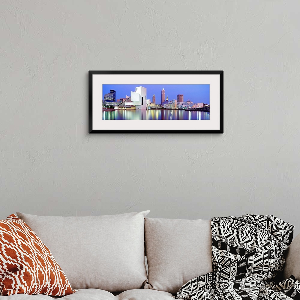 A bohemian room featuring Large, panoramic photograph of the Cleveland skyline at dusk, reflecting in the waters of Lake Erie.