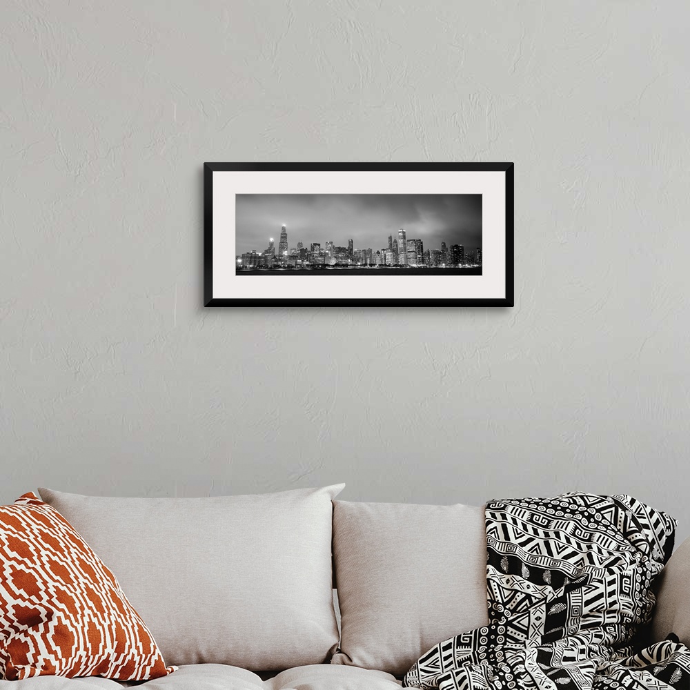 A bohemian room featuring Panoramic view of the Chicago city skyline in the early evening, with city lights reflecting off ...