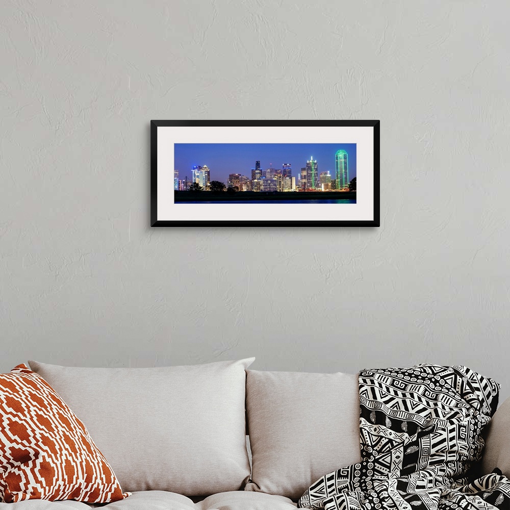 A bohemian room featuring The city skyline of Dallas at night.