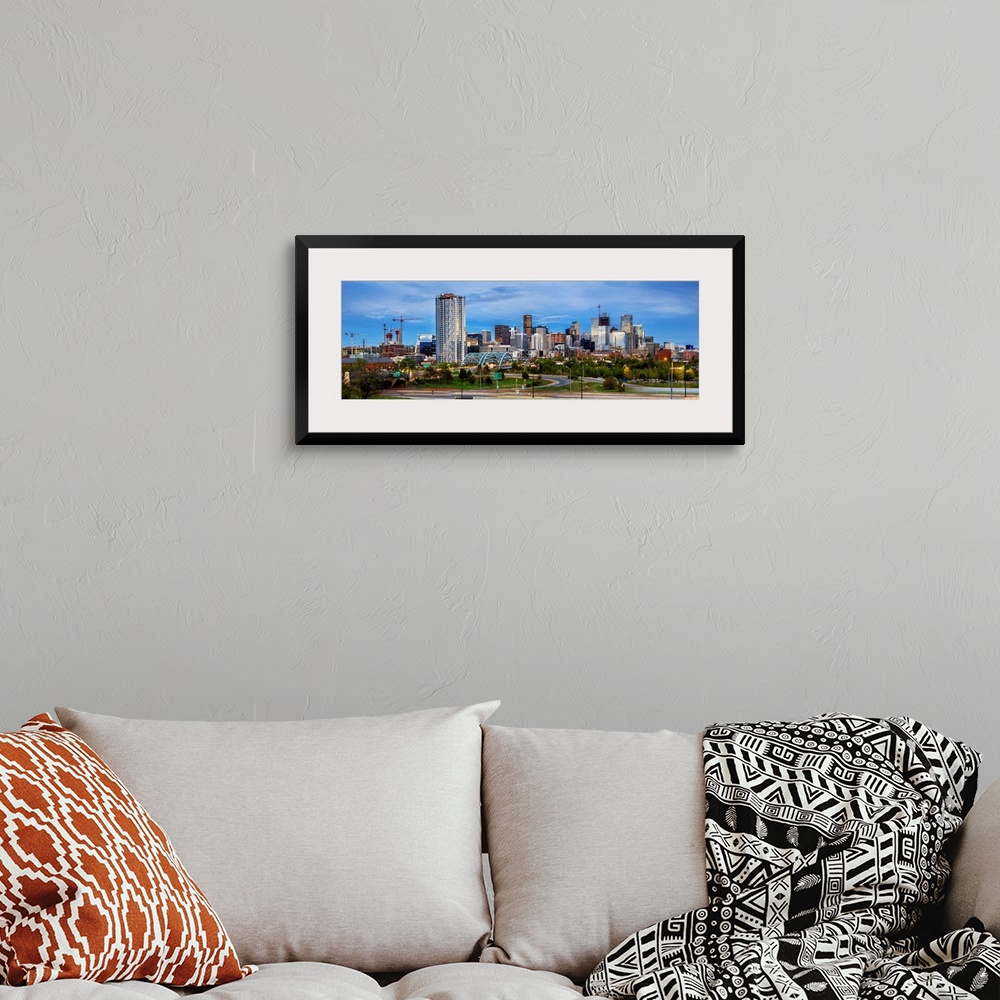 A bohemian room featuring Photo of a Denver's skyline with light trails.