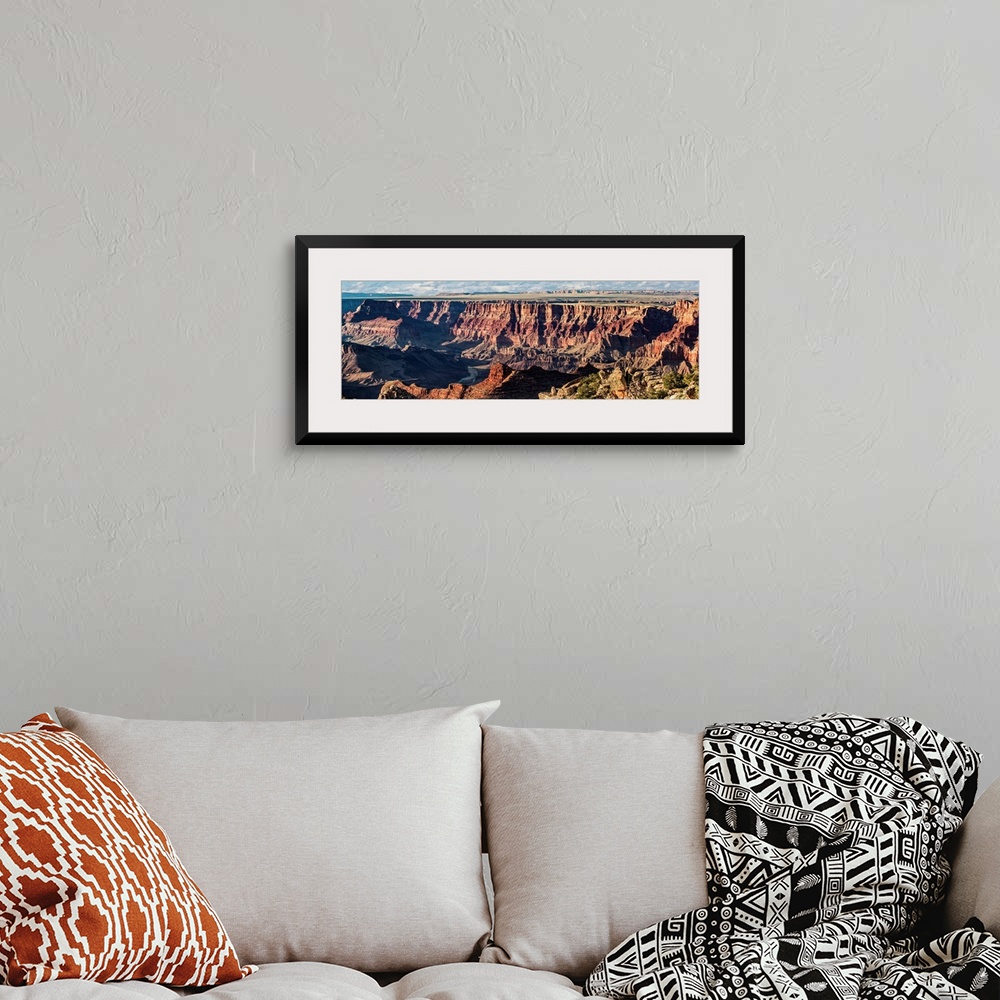 A bohemian room featuring Panoramic photograph of Grand Canyon National Park.