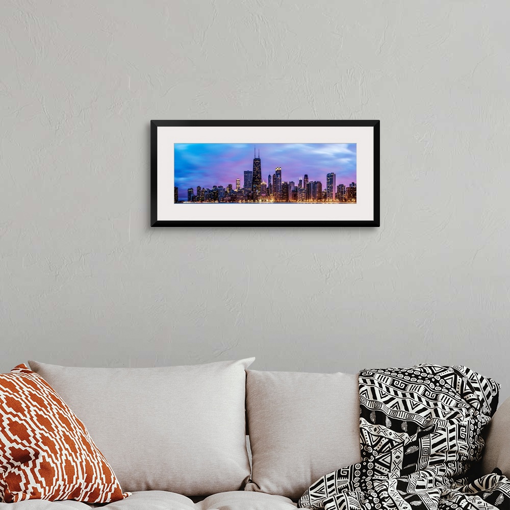 A bohemian room featuring Photo of Chicago skyline at night under cotton candy colored clouds.