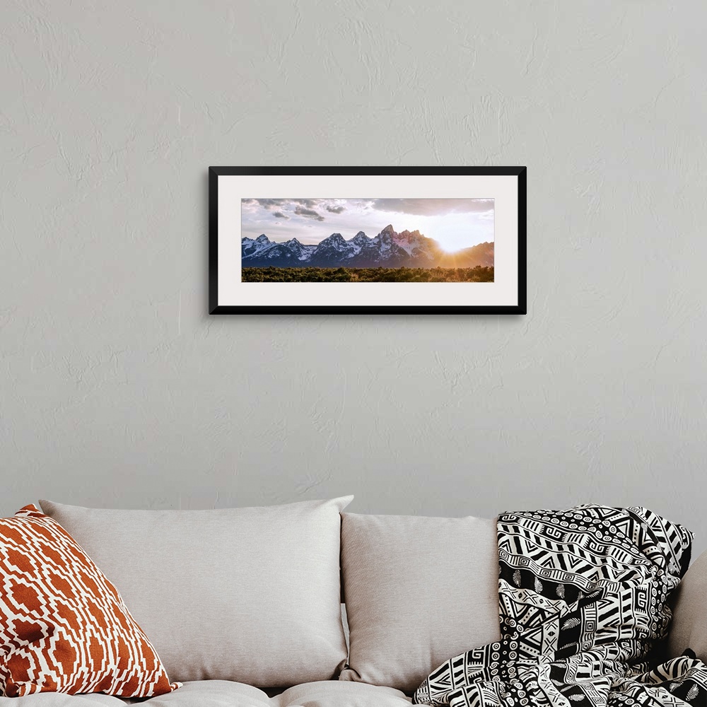 A bohemian room featuring Panoramic view of the sun rising over Teton mountains in Wyoming.