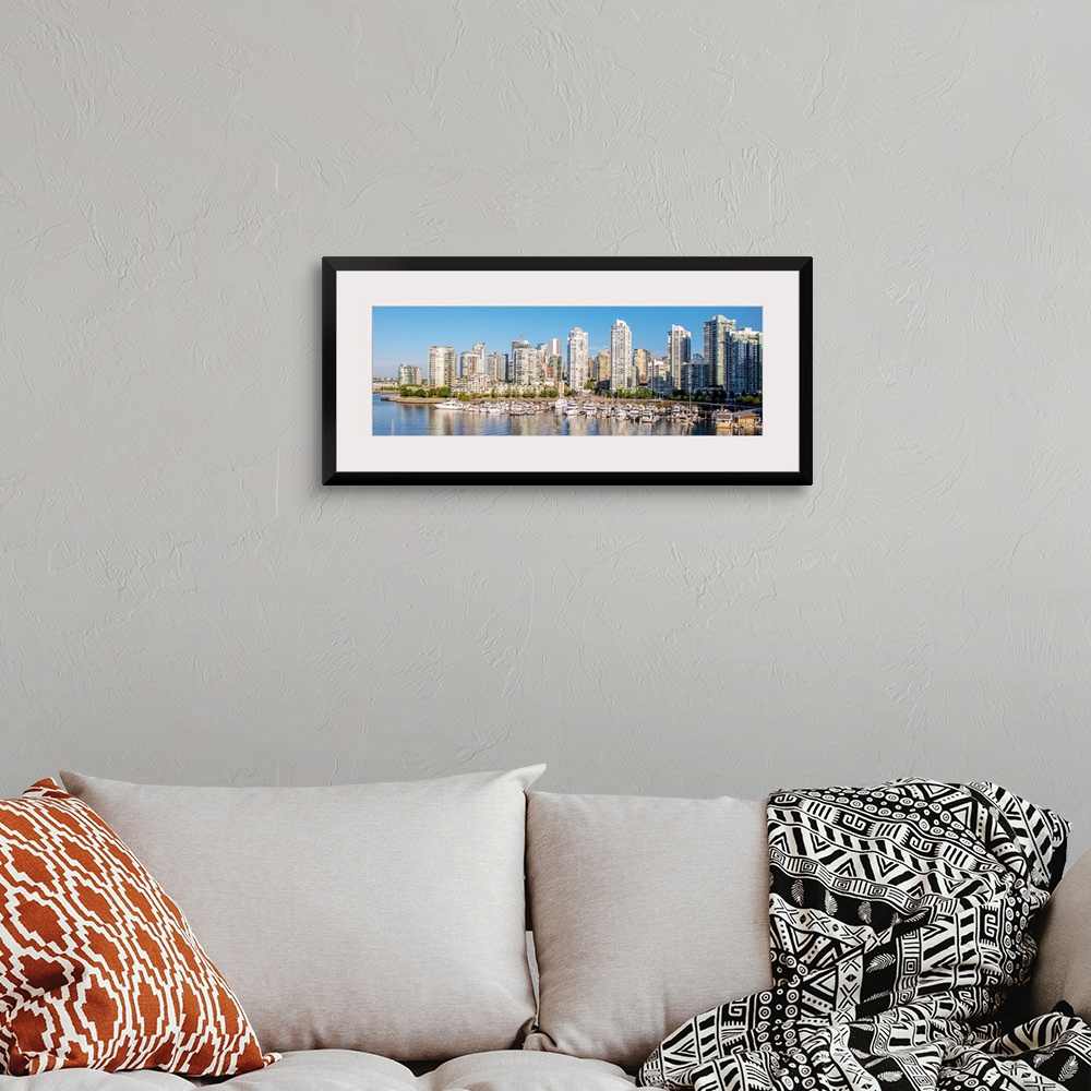 A bohemian room featuring Panoramic photograph of part of the Vancouver, British Columbia skyline with False Creek Harbor a...