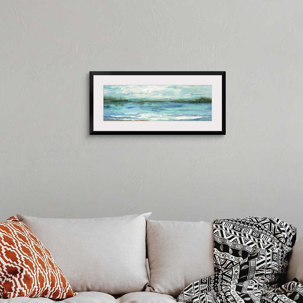 A bohemian room featuring Contemporary landscape painting of a lake scene.