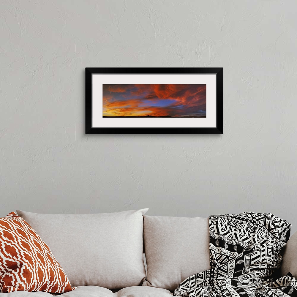 A bohemian room featuring Clouds in the sky at sunset, Taos, Taos County, New Mexico, USA