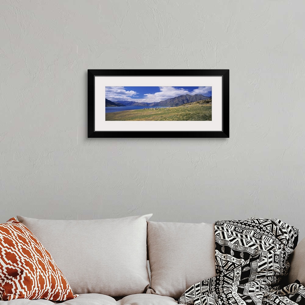 A bohemian room featuring Clouds over mountains, Lake Hawea, Otago, Wanaka, South Island, New Zealand