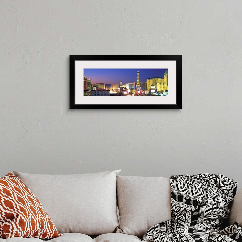 A bohemian room featuring Panoramic photograph showcasing the bright neon lights of the busy strip in Las Vegas, Nevada at ...