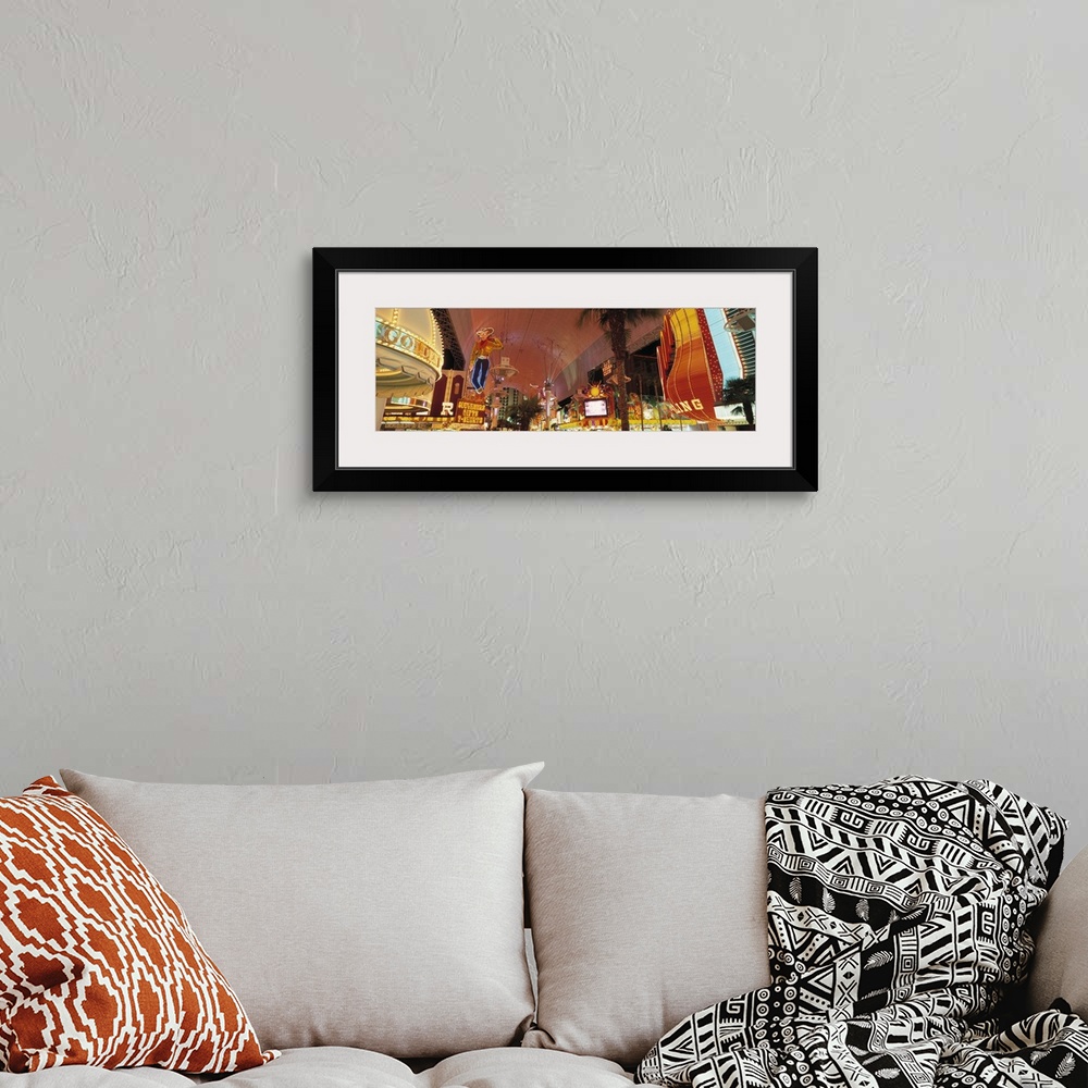 A bohemian room featuring Horizontal photo of the Las Vegas Strip lit up from street view.