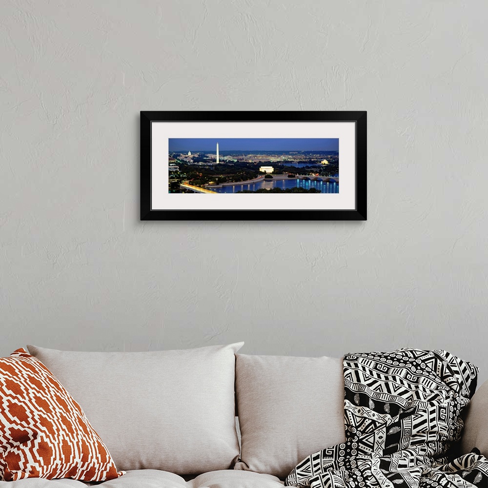 A bohemian room featuring Panoramic photograph of the nation's capital at night with bright lights reflected in the water. ...