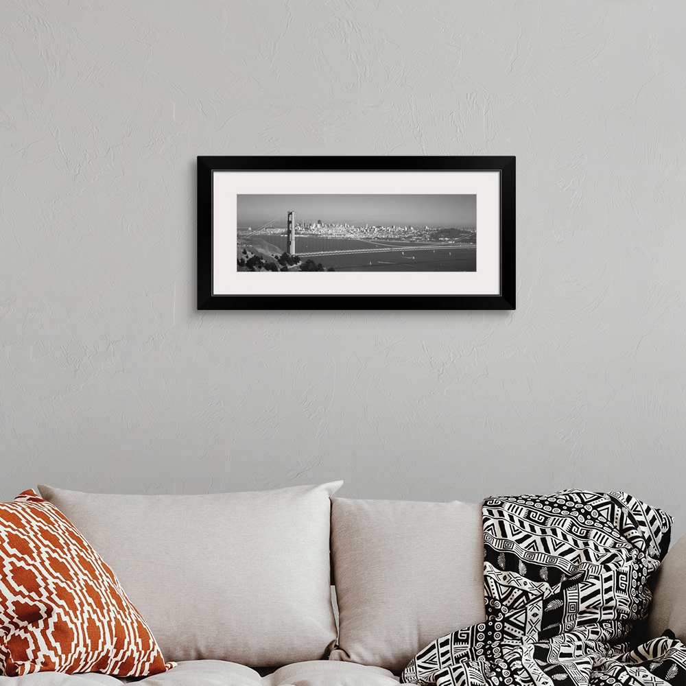 A bohemian room featuring Panoramic photograph of iconic west coast city overpass with city skyline in the distance on a fo...