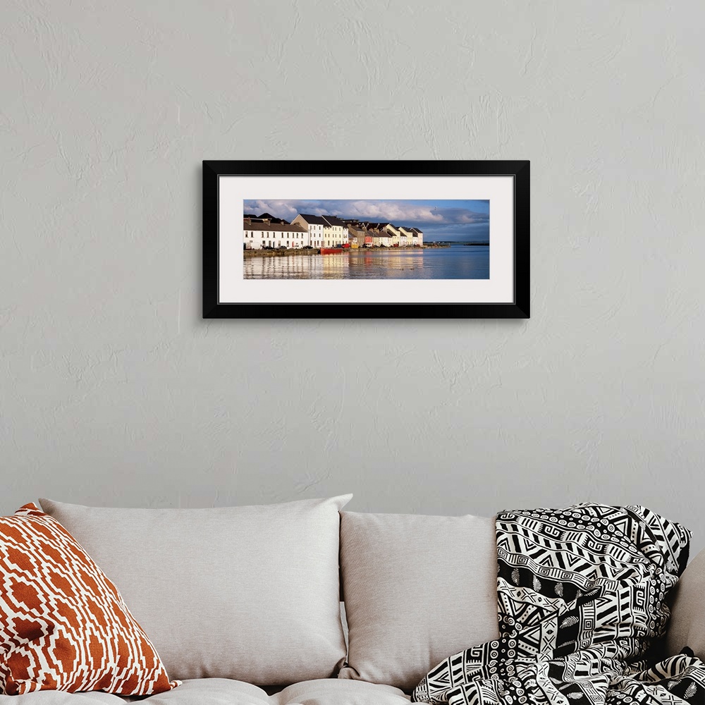 A bohemian room featuring Long horizontal photo print of colorful Irish buildings and houses along the waterfront.