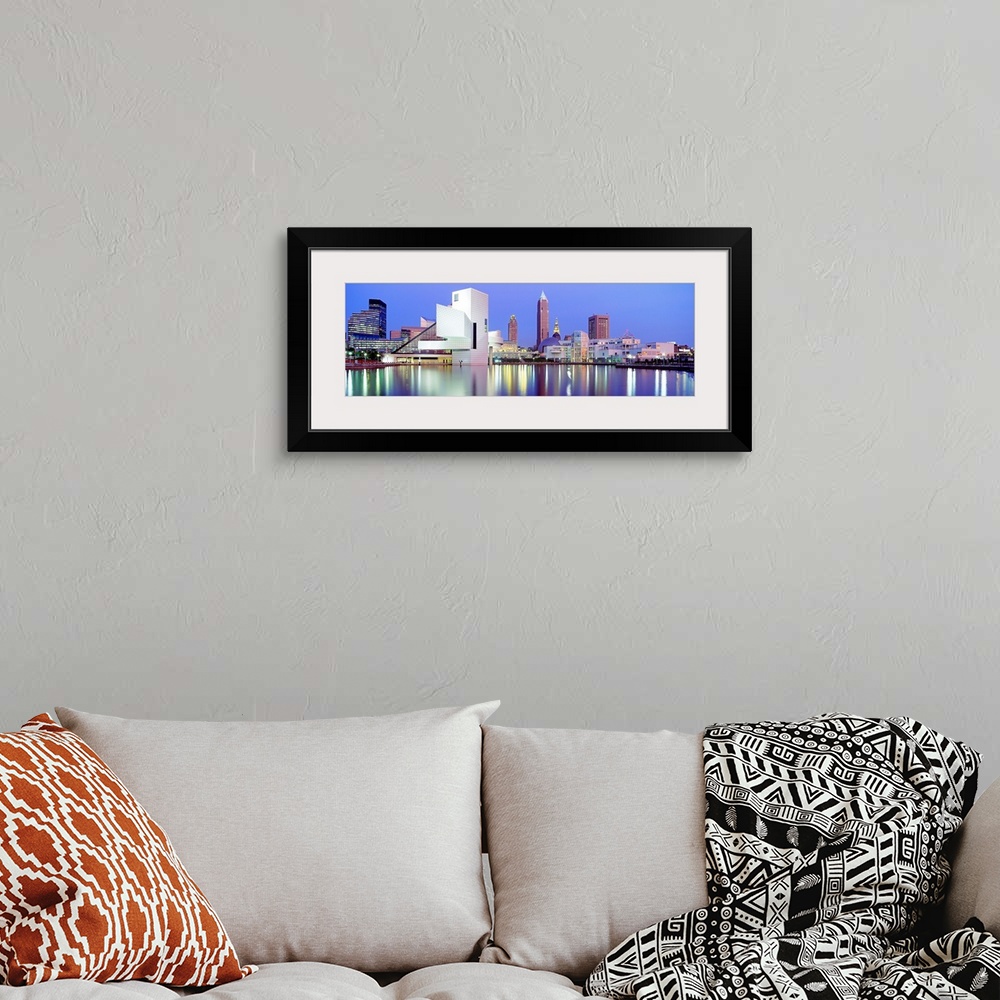 A bohemian room featuring Large, panoramic photograph of the Cleveland skyline at dusk, reflecting in the waters of Lake Erie.