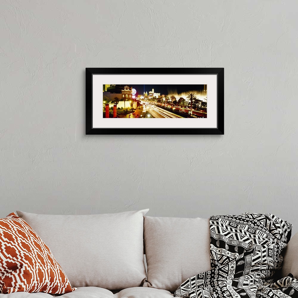 A bohemian room featuring Panoramic photograph of light trails from cars driving down the Las Vegas strip, bright lights sh...