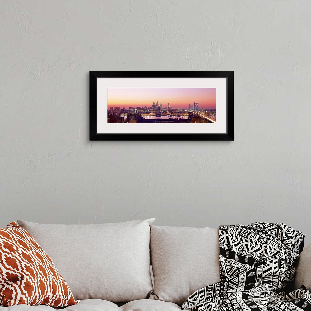 A bohemian room featuring Panoramic photograph displays the busy skyline and Benjamin Franklin bridge in Philadelphia, Penn...