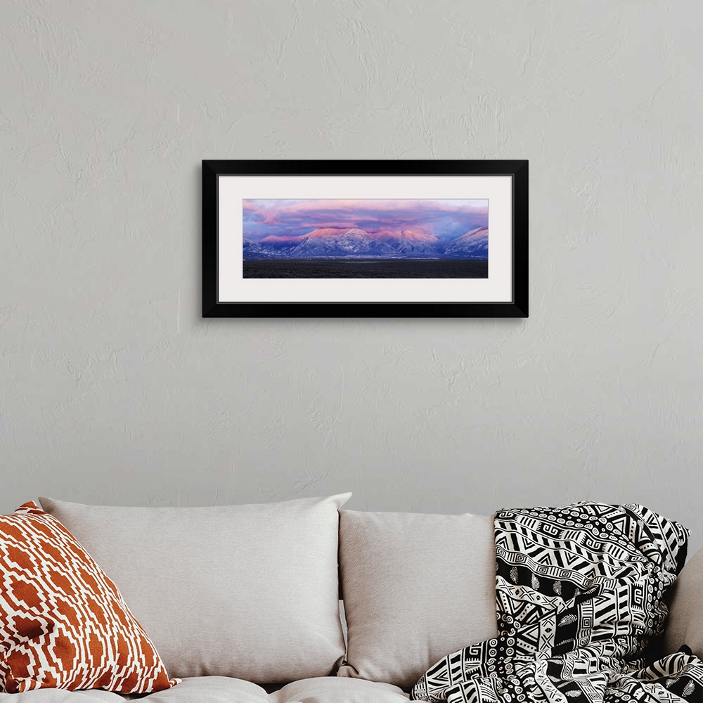 A bohemian room featuring Sunset over mountain range, Sangre De Cristo Mountains, Taos, Taos County, New Mexico, USA