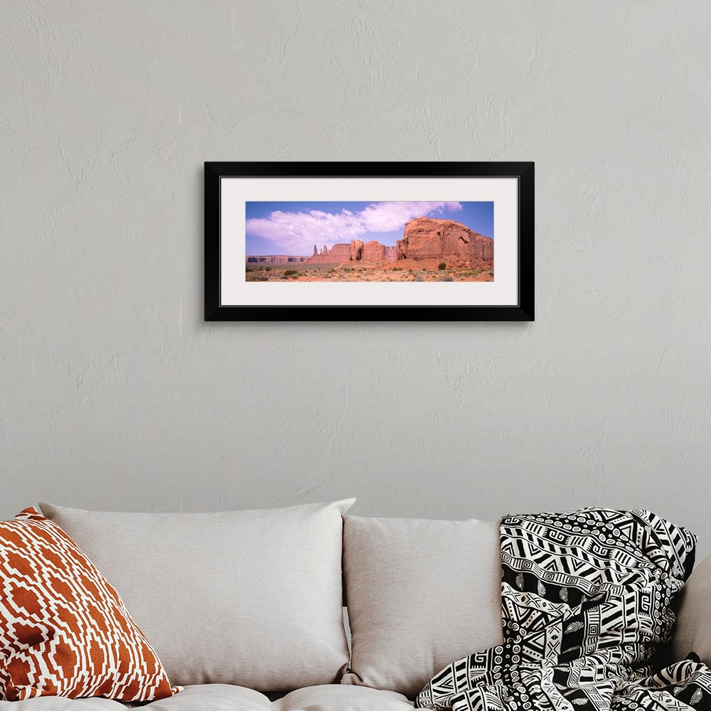A bohemian room featuring Three Sisters & Camel Butte Monument Valley AZ