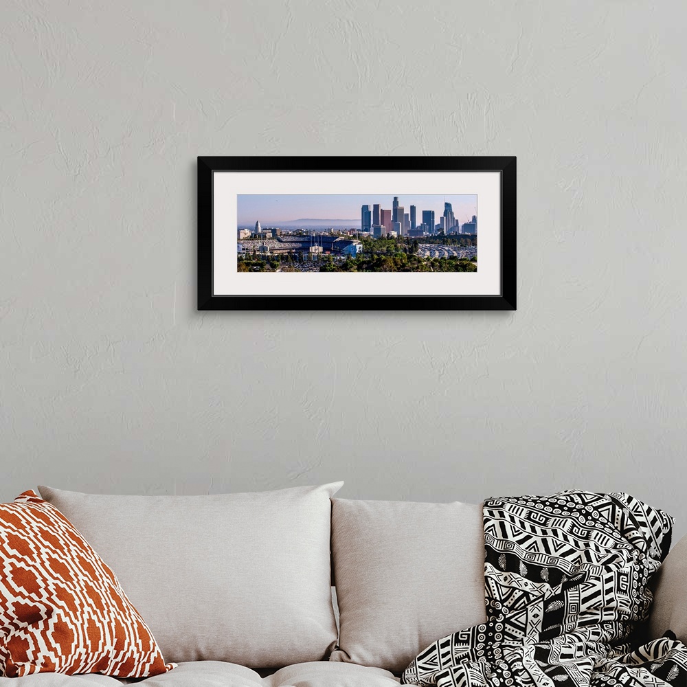 A bohemian room featuring Panoramic photograph of the downtown Los Angeles skyline with Dodger Stadium on the left.