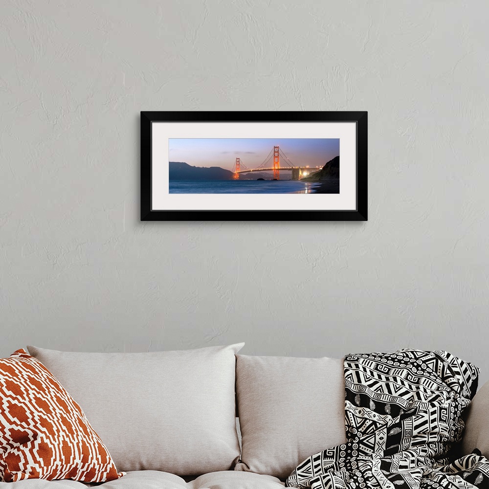 A bohemian room featuring Panoramic photograph at twilight of the Golden Gate Bridge taken from the shore.