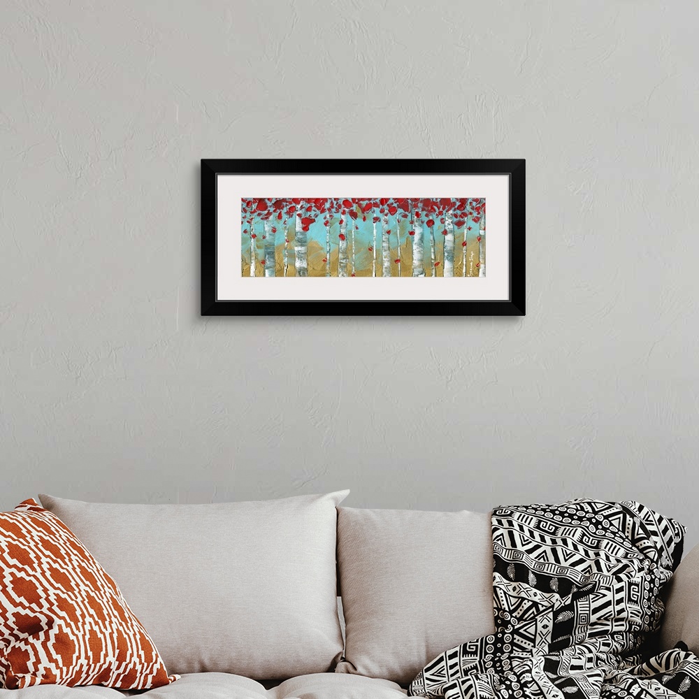 A bohemian room featuring Panoramic painting of Birch trees on a gold and light blue background with bright red leaves.