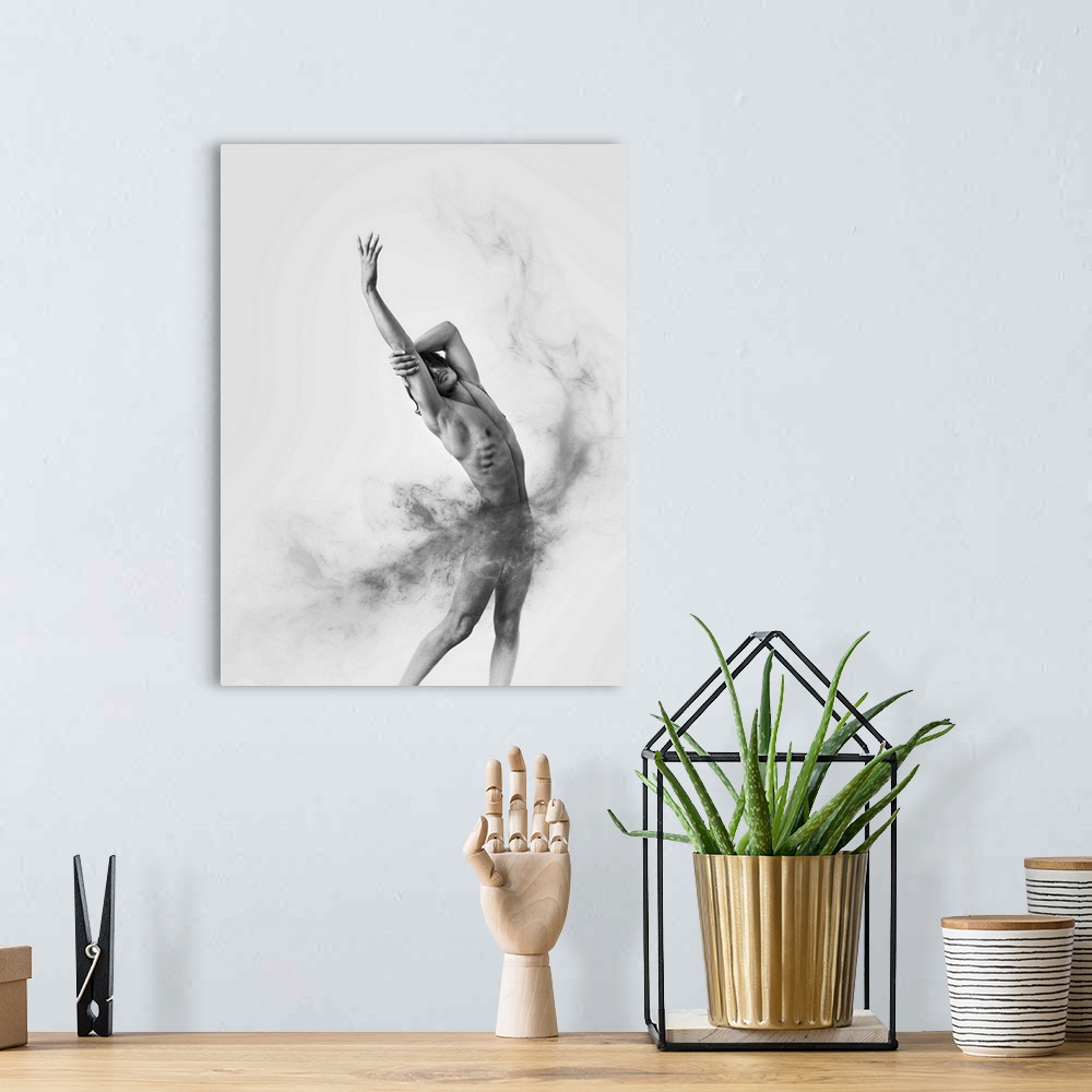 A bohemian room featuring Black and white fine art photograph of a male model posing gracefully and gray smoke moving aroun...