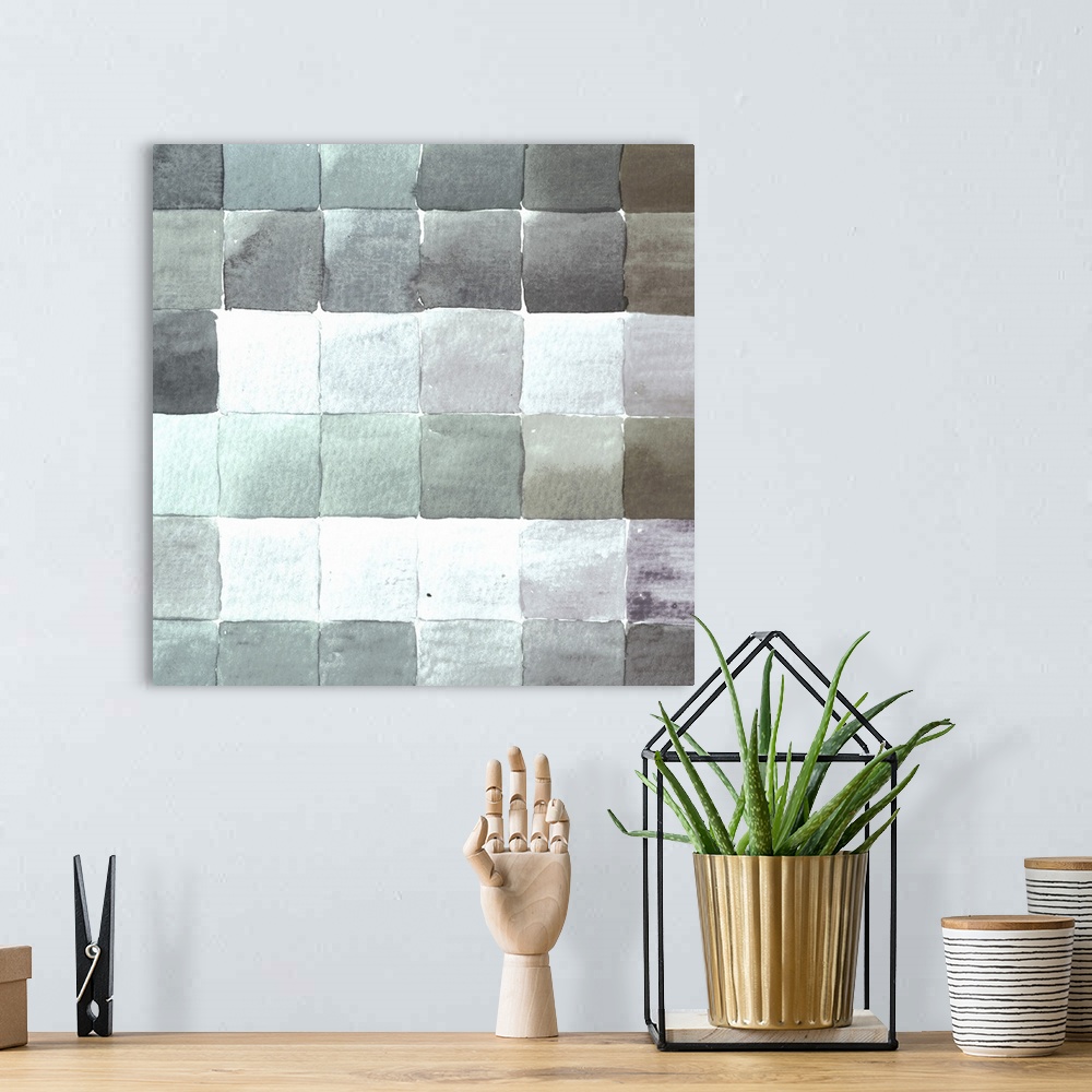 A bohemian room featuring Contemporary artwork of square tiles in various cool tones.