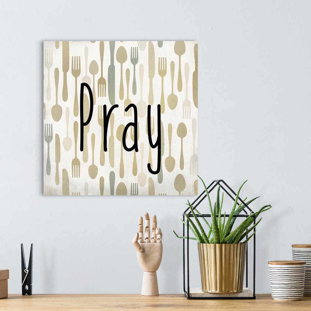 A bohemian room featuring The word Pray in black text over a pattern of forks, spoons, and knives.