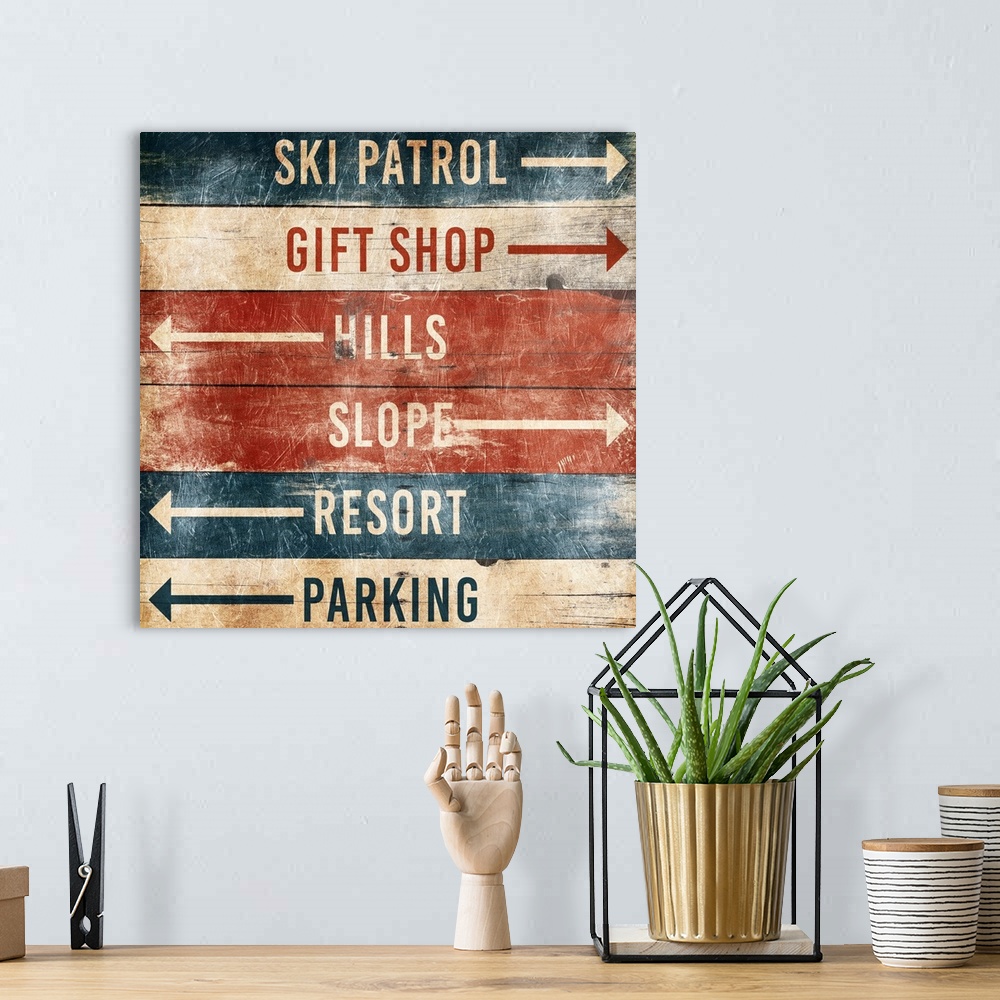 A bohemian room featuring A wooden sign with arrows pointing the way to area at a ski resort.