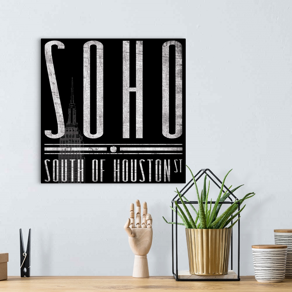 A bohemian room featuring Typographical artwork of New York City destination SOHO against a black background, with the Empi...