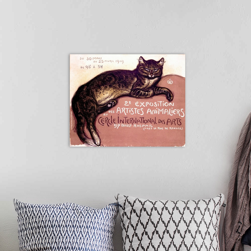 A bohemian room featuring An antiqued poster with a painting of a cat laying down on canvas.