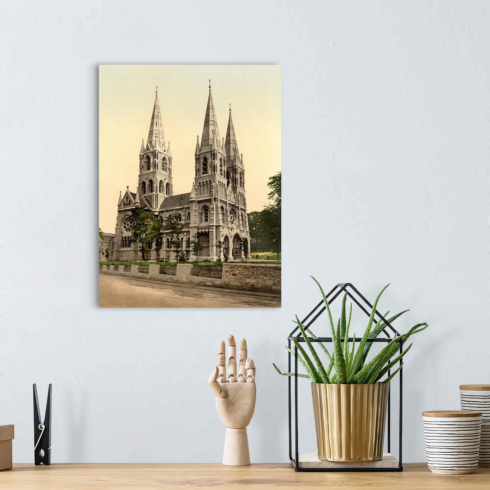 A bohemian room featuring Hand colored photograph of St. Finbarros cathedral, country cork, Ireland.