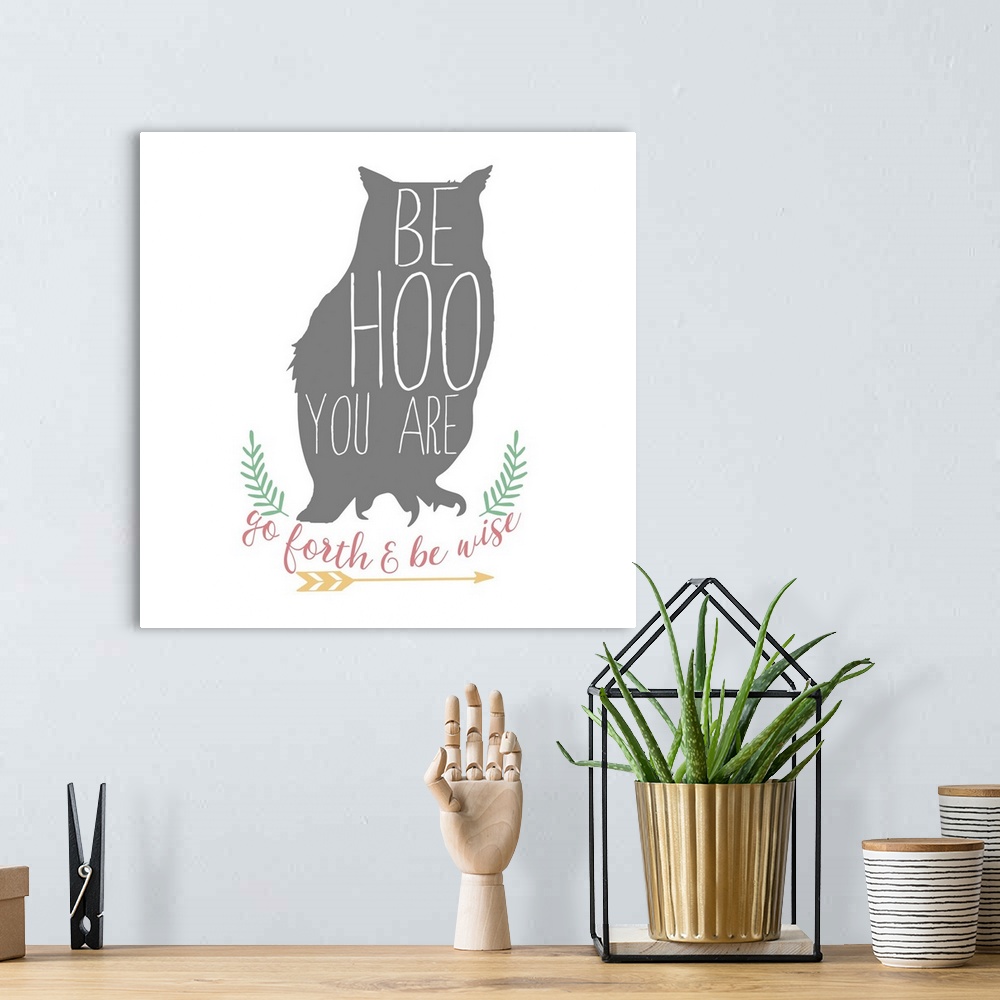 A bohemian room featuring Playful typography on a silhouette of an owl reading "Be Hoo You Are" and "Go Fourth and Be Wise"...