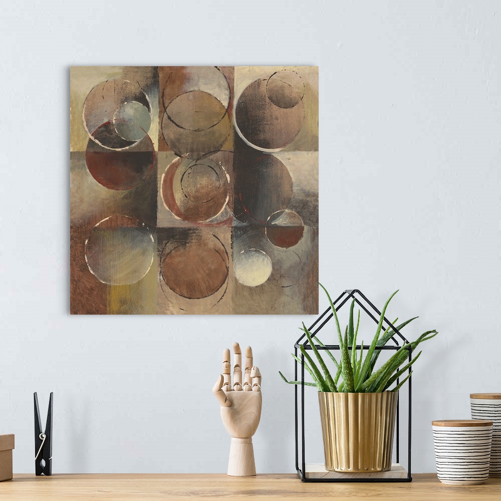 A bohemian room featuring Abstract painting using geometric and organic shapes in earth tones.