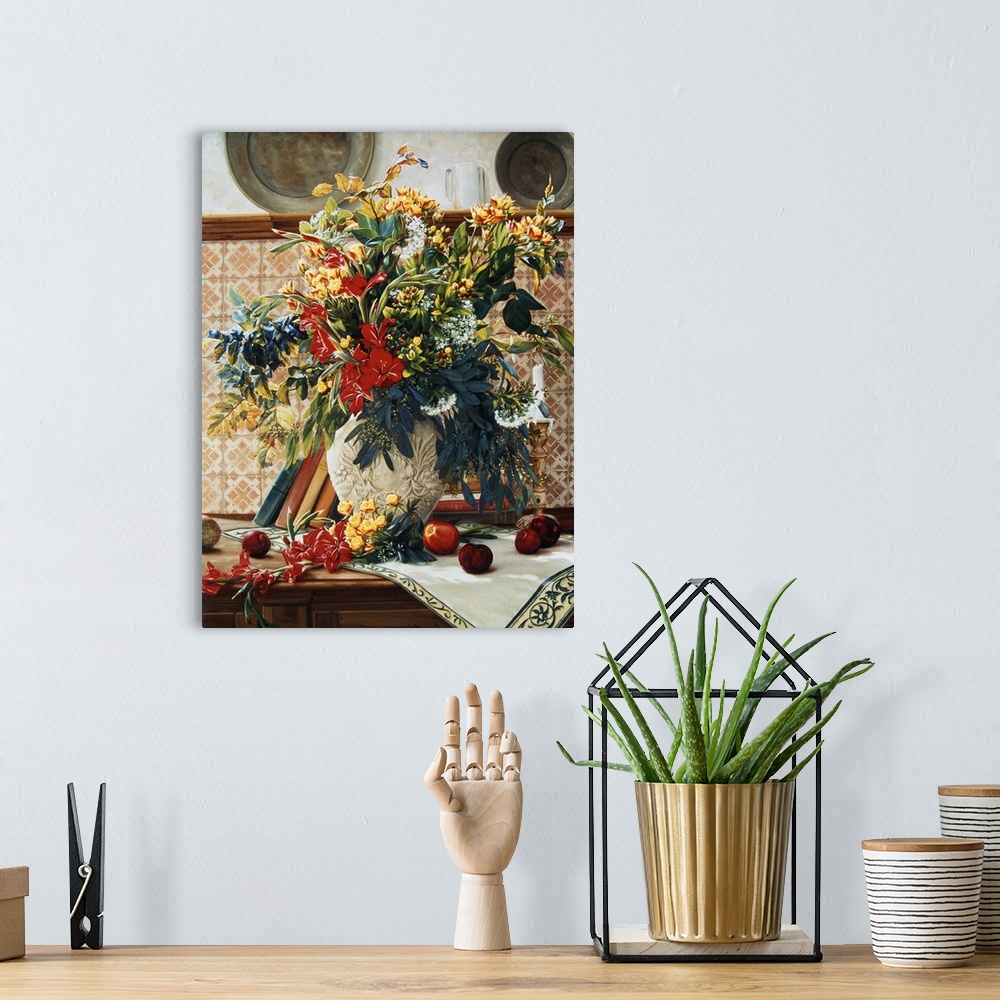 A bohemian room featuring Bouquet of flowers in a white vase on a table with more flowers ready to go in the vase.