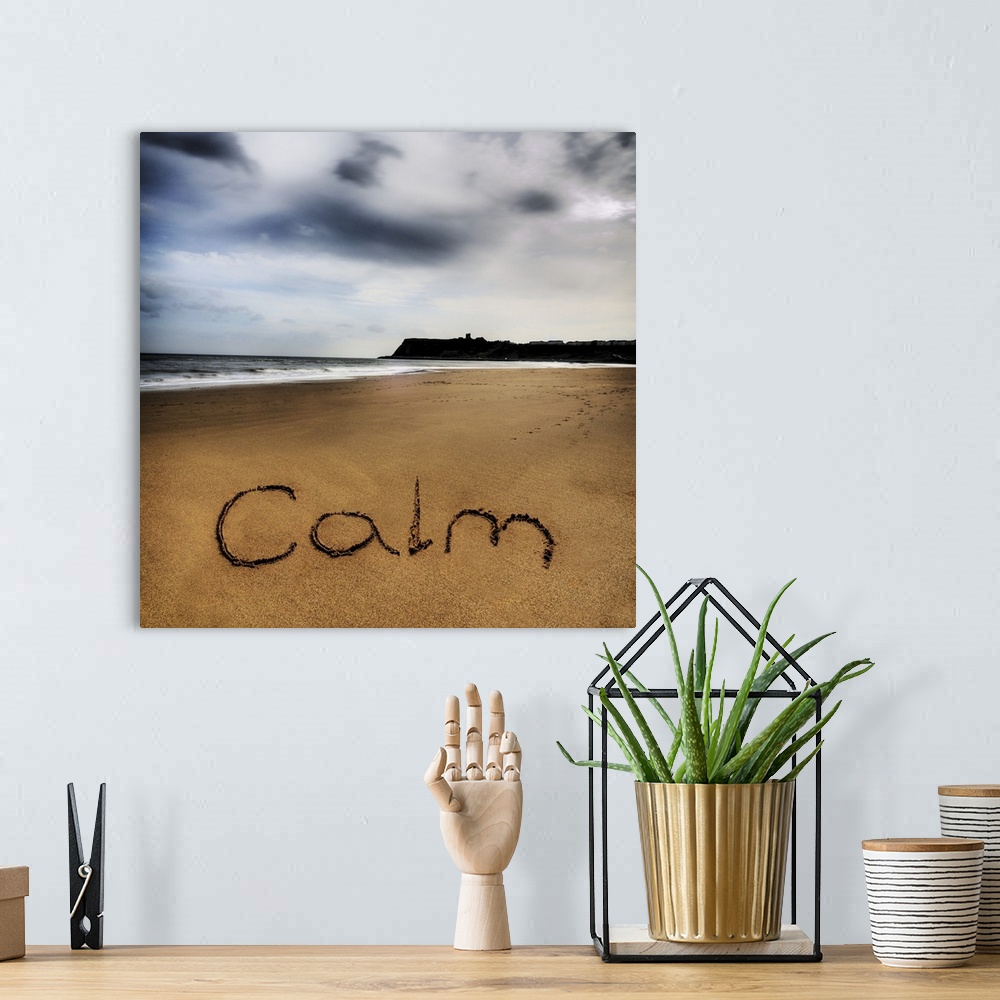 A bohemian room featuring Photo of the word written in the sand: Calm.